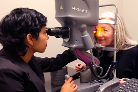 Dr. Sandra Sieminski performing a cataract lens exam with a female patient. 